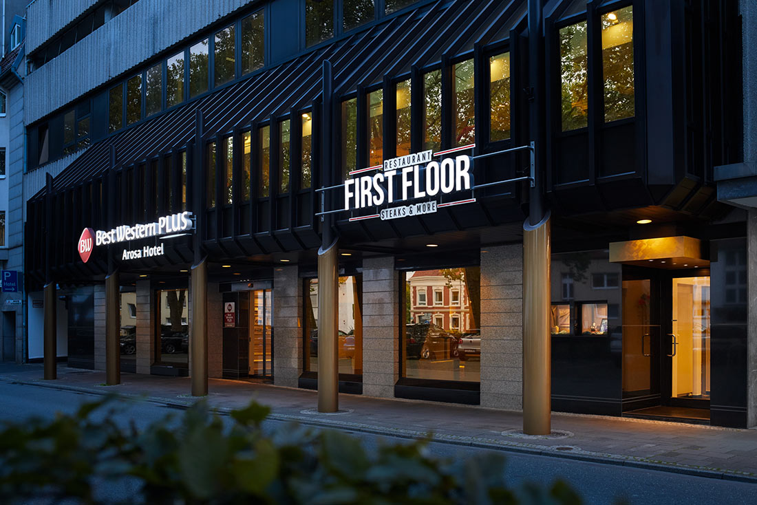 Exterior façade of the restaurant with illuminated sign