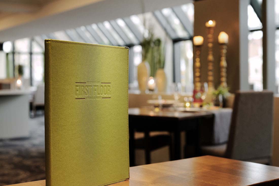 Menu in the foreground, restaurant in the background